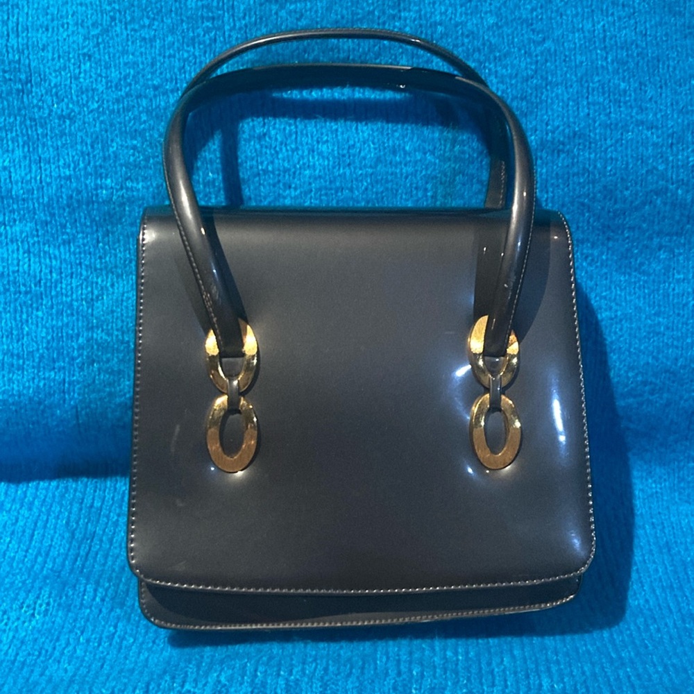 Elegant Black Handbag with Gold Accents
